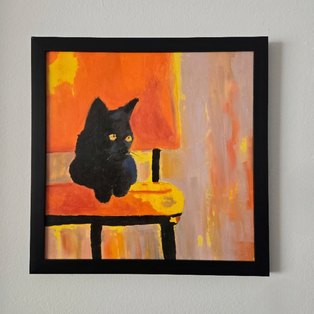 Black Cat on Orange Chair Wall Art Print